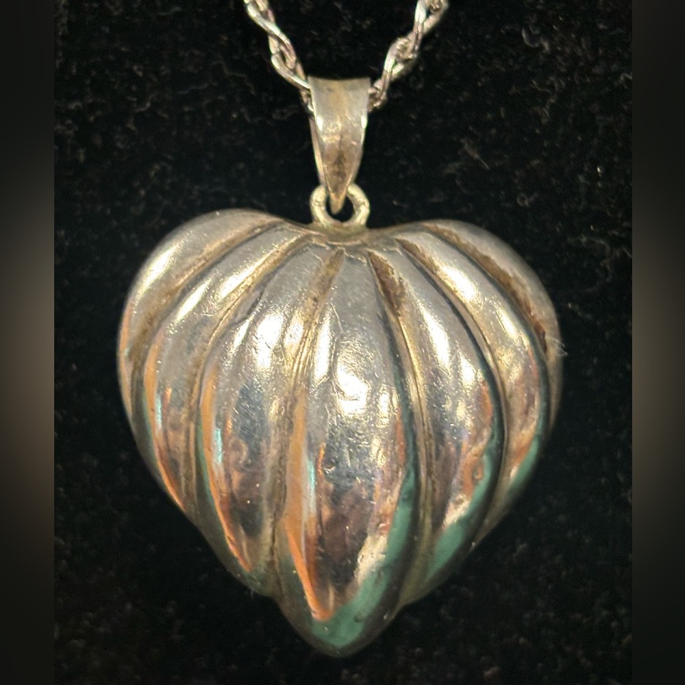 Silver puff heart necklace.